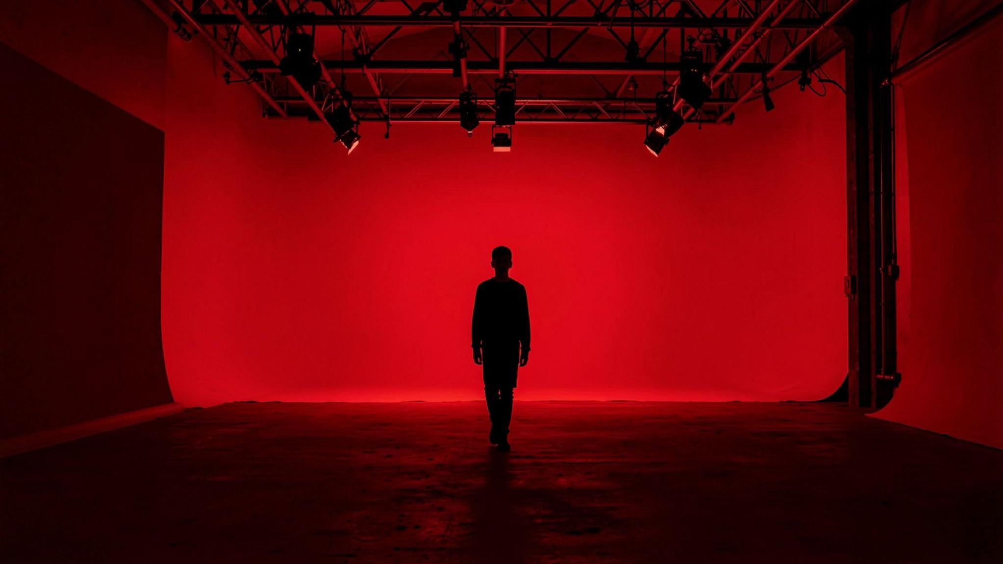 A vivid red creative studio from the NEXORA presentation